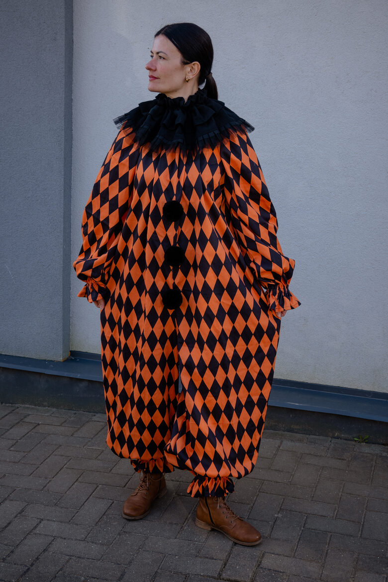 Orange and black clown suit